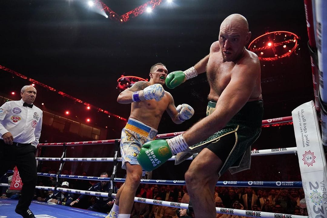 Fury on the verge of careening into the ropes, moments before the referee calls the knockdown - his hands aren't up, his eyes are elsewhere.